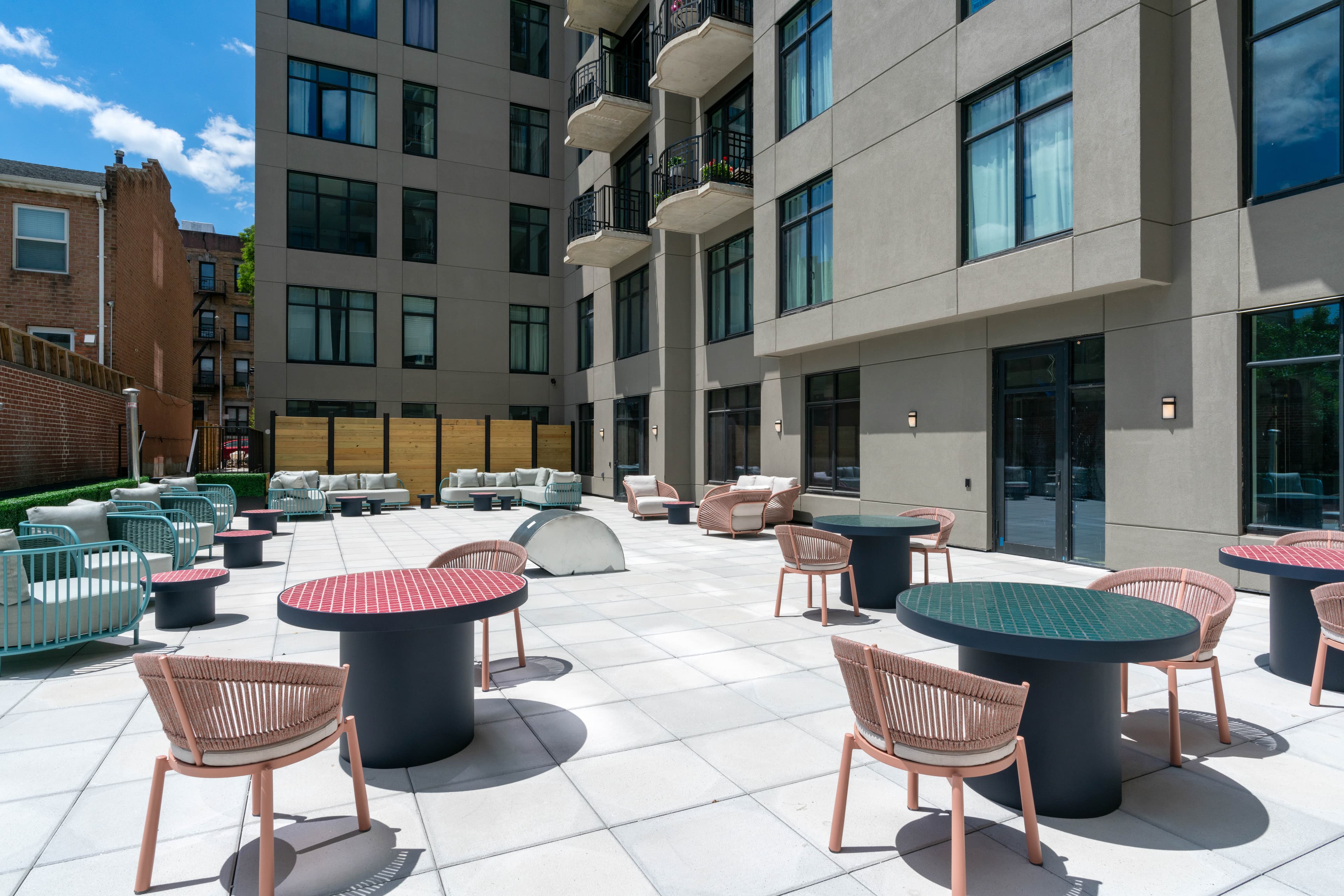 Rooftop terrace lounge at 875 Fourth Avenue; contact the leasing office to schedule a tour of luxury apartments in Sunset Park Brooklyn