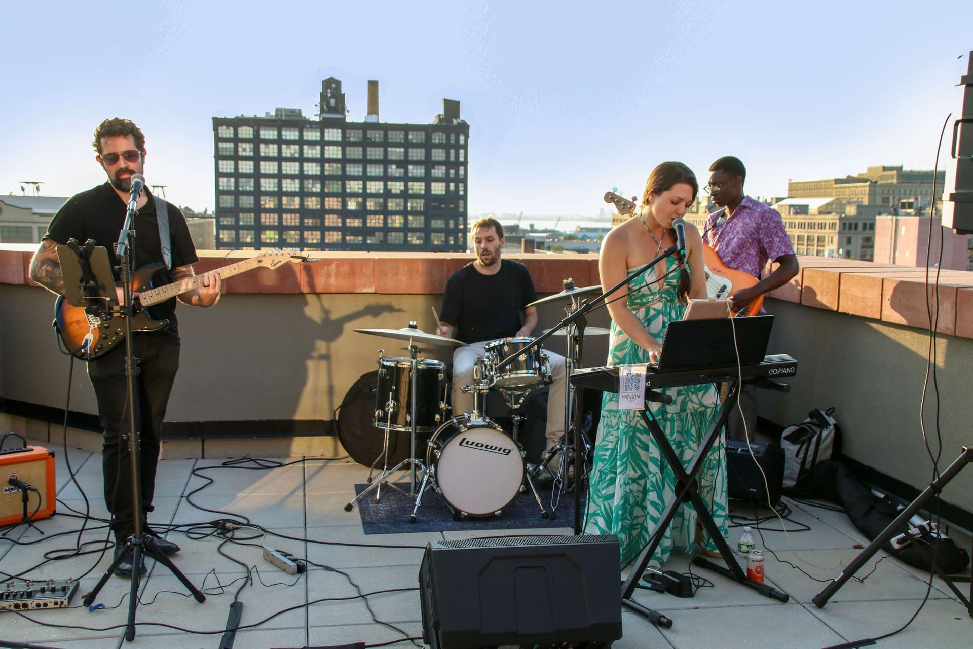 The live band mid-set on the rooftop terrace at 875 Fourth Avenue