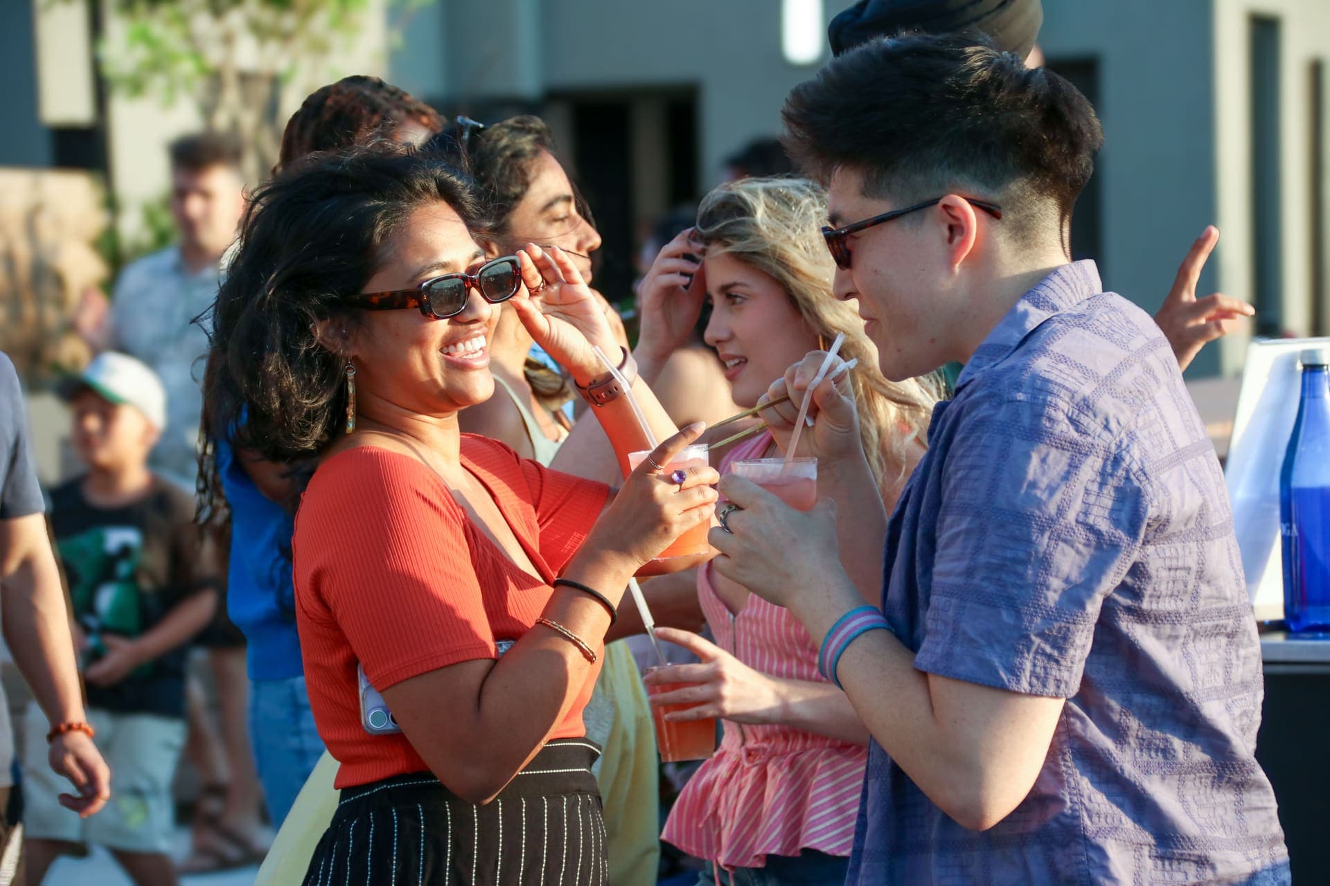 A group of residents raising a toast together on the rooftop terrace at 875 Fourth Avenue